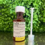 Nitazoxanide 150mg/mL Marshmallow Flavored Oral Liquid for dogs and cats in a 60mL bottle with dosing syringe.